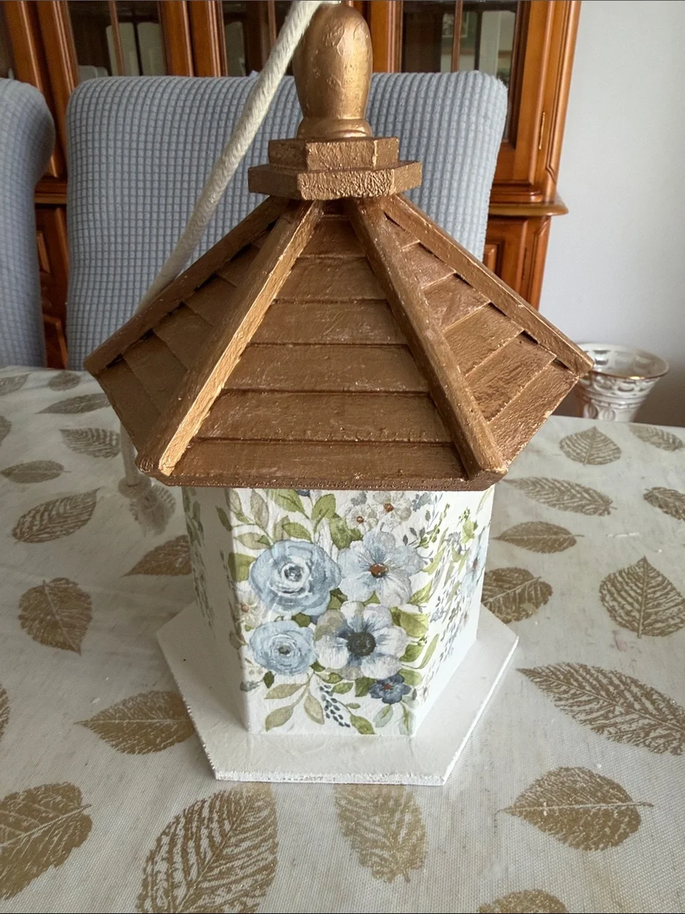 White Birdhouse with Gold Roof and Blue Floral Accents wooden